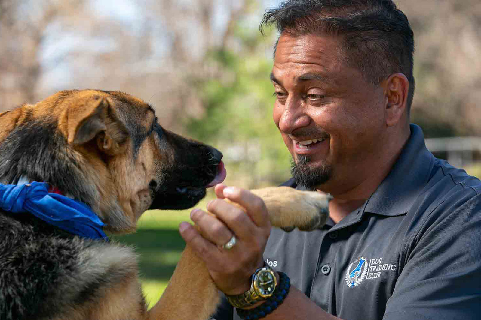 Franchise owner with pup who is excited about Dog Training Elite's top home based franchise.