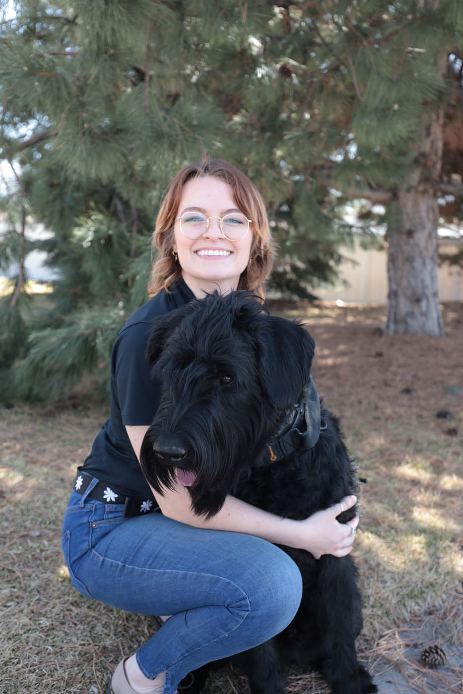 A Dog Training Elite Gilbert owner with her black lab dog, our obedience training for dogs in Gilbert, AZ can help strengthen your bond.