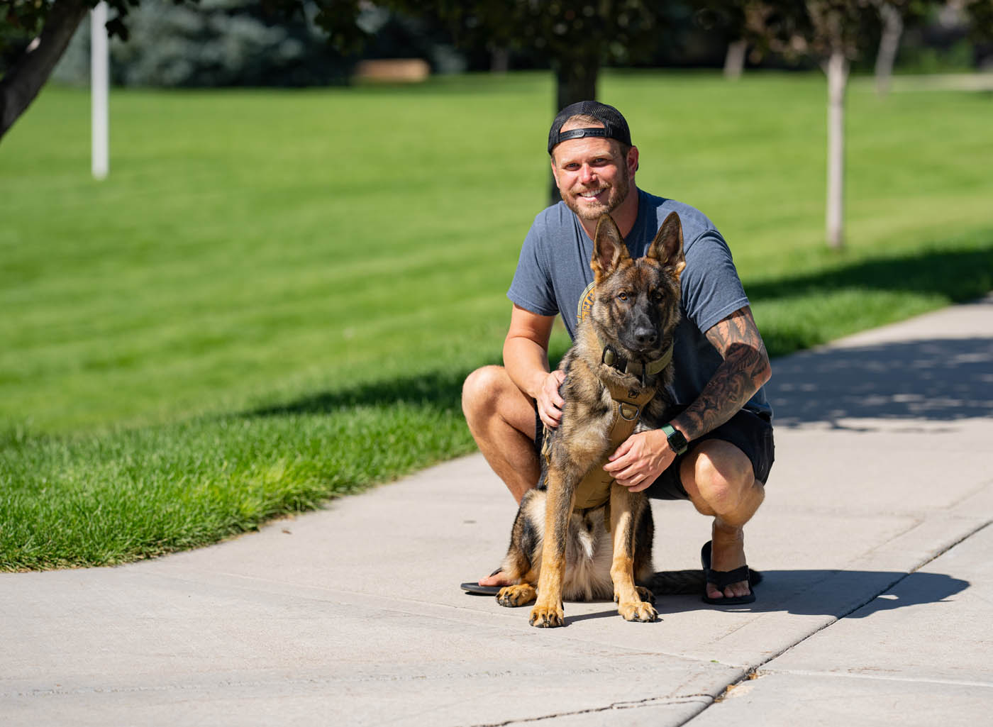 A dog owner with his German Shepherd - get your professional german shepherd training in Katy, TX with Dog Training Elite today.