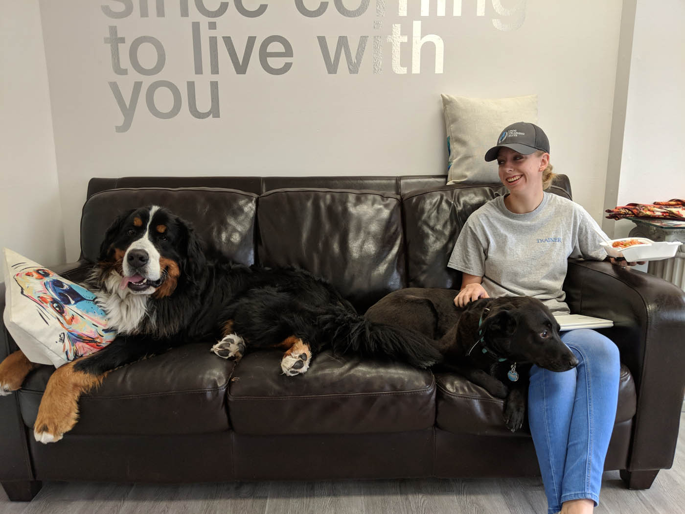 A DTE sitting with their dog at one of our top dog training facilities in Fort Worth, TX.