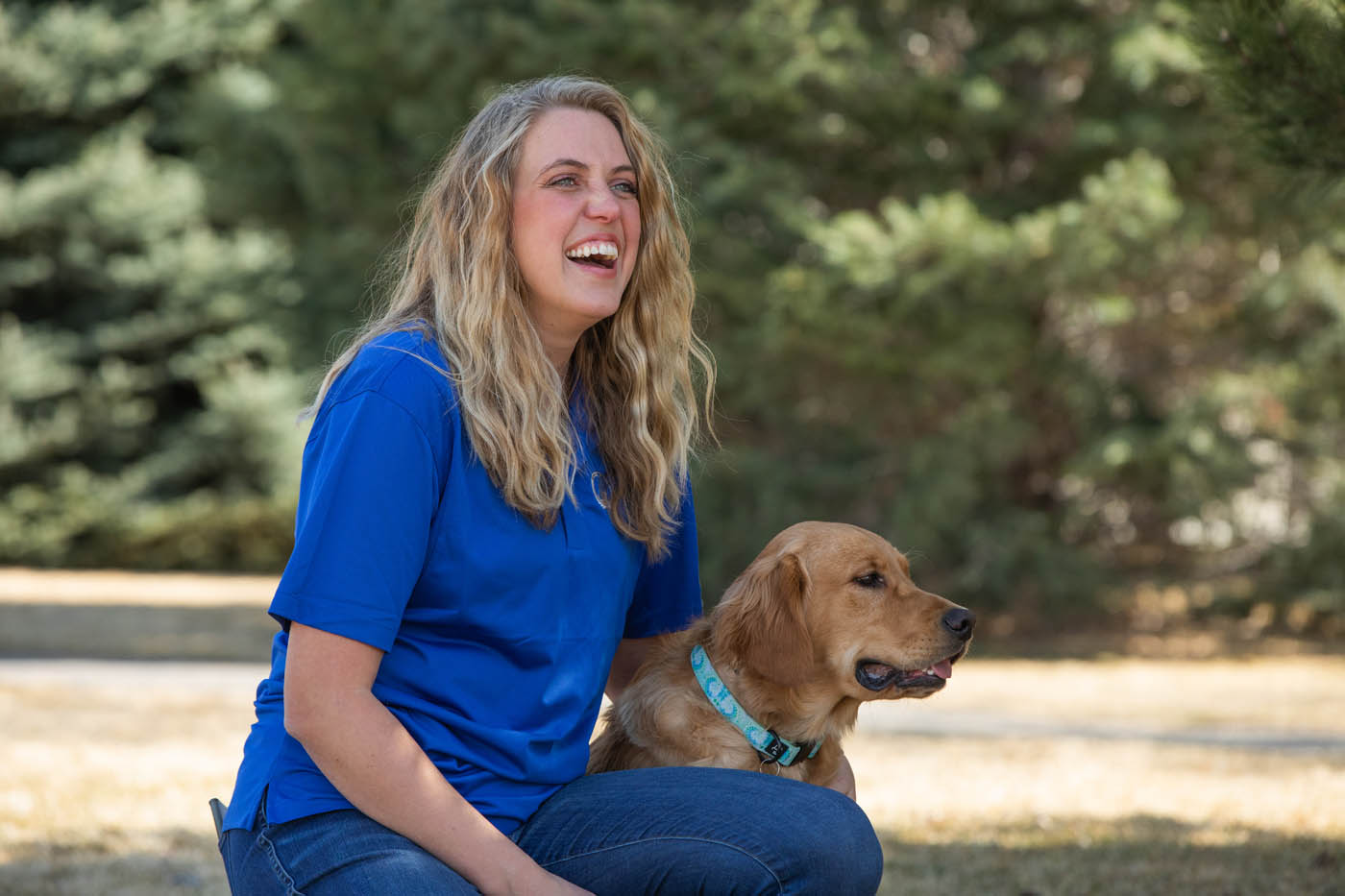 An owner and their happy, healthy dog with expert training from Dog Training Elite Northern Colorado.